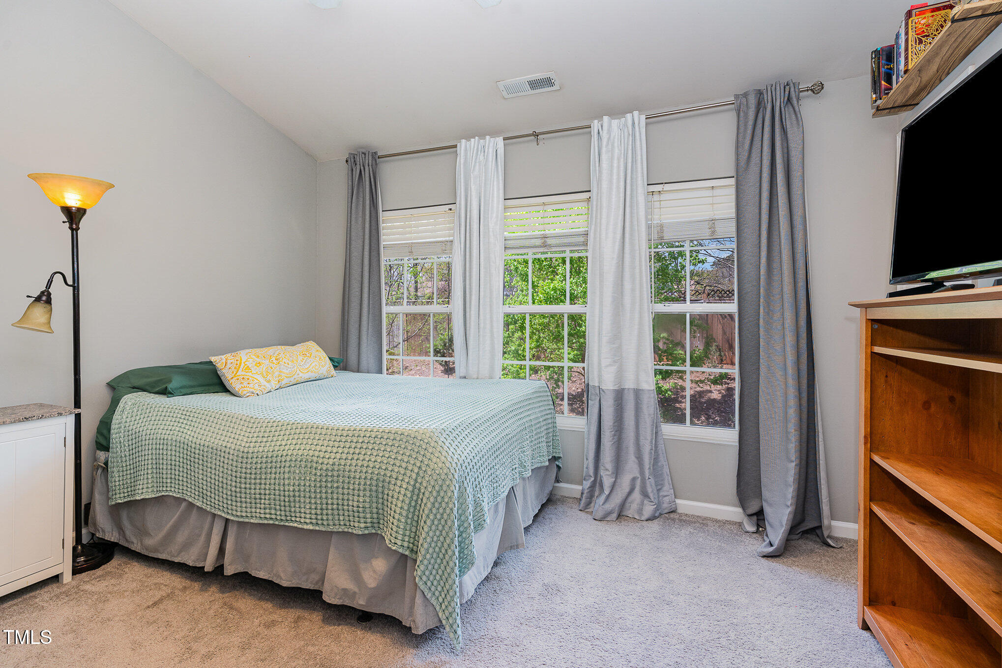 1812 Natalie Brook Way Raleigh, NC 27609 - Photo 20 of 31 a bedroom with a bed and a tv