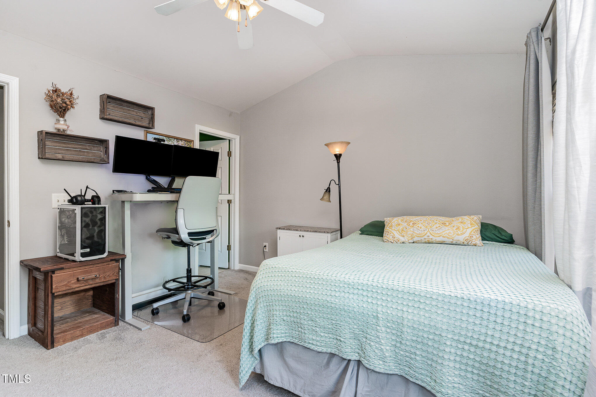1812 Natalie Brook Way Raleigh, NC 27609 - Photo 21 of 31 a bedroom with a bed a table and chair