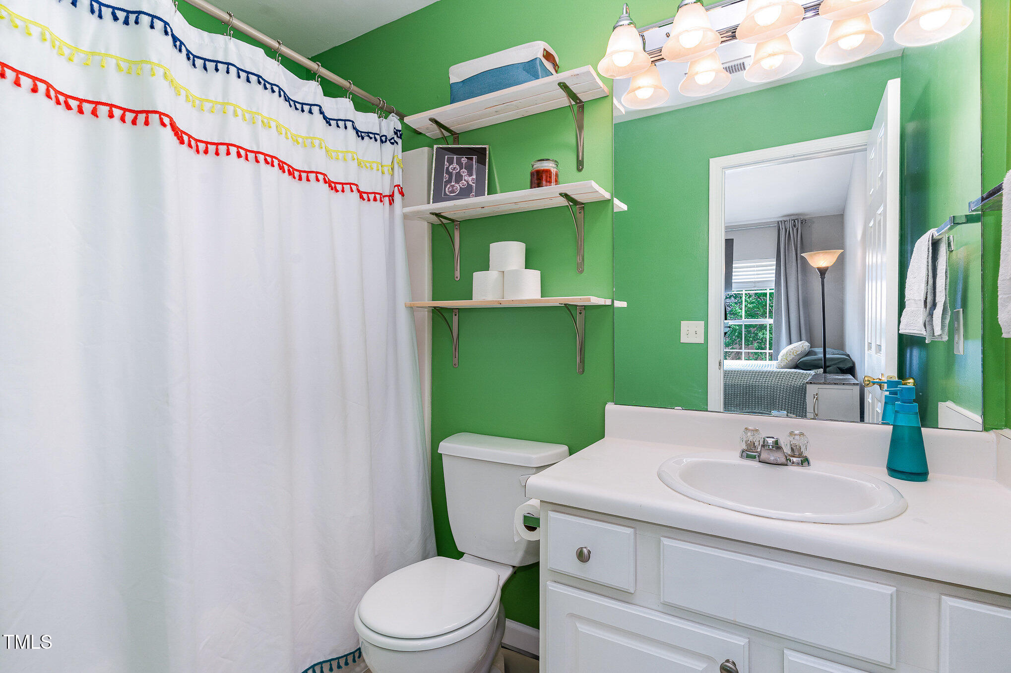 1812 Natalie Brook Way Raleigh, NC 27609 - Photo 23 of 31 a bathroom with a sink and toilet