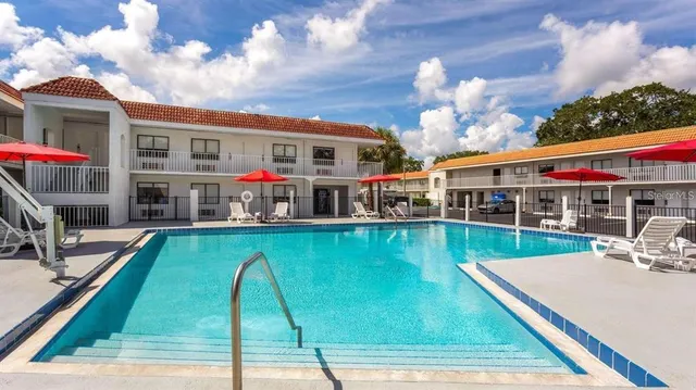 a view of a swimming pool with a patio
