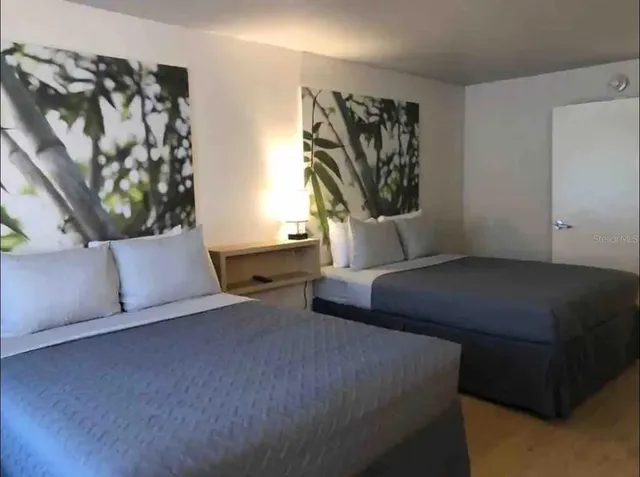 a bathroom with a toilet and a shower curtain