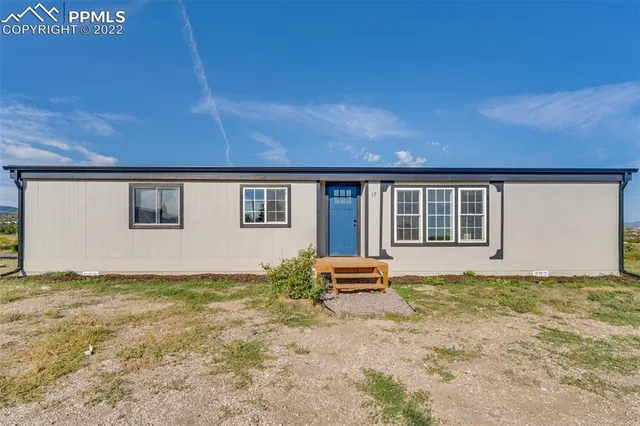 a house view with a garden space
