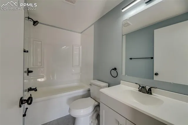 a bathroom with a sink toilet tub and shower