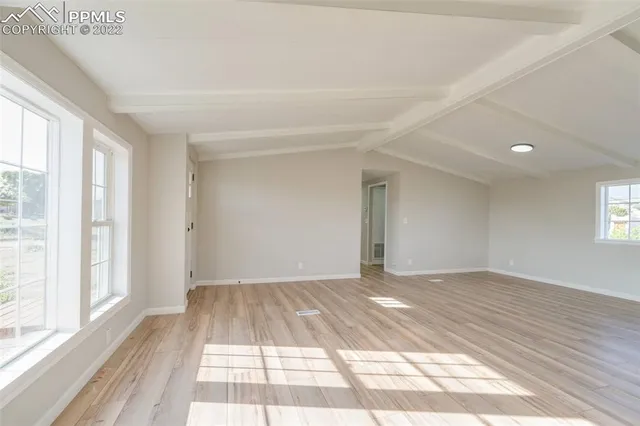 a view of an empty room and window