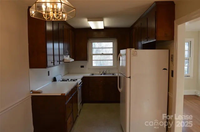 a kitchen with a refrigerator and a sink