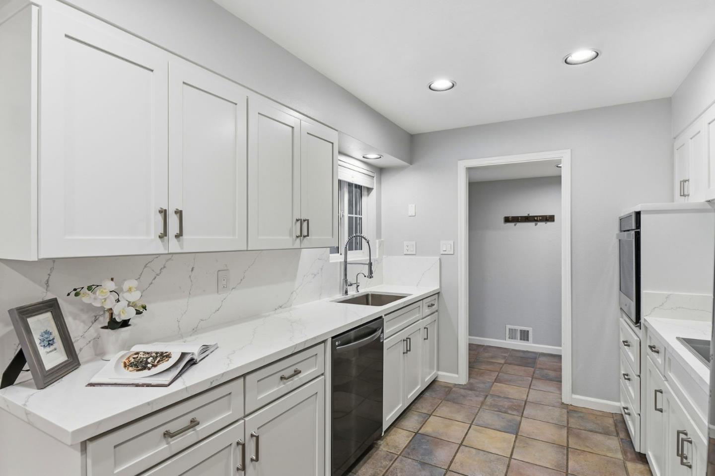 1663 Curtner Avenue San Jose, CA 95125 - Photo 11 of 57 a kitchen with a sink stove and refrigerator