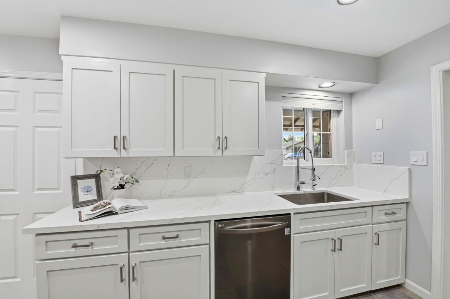 1663 Curtner Avenue San Jose, CA 95125 - Photo 7 of 57 a kitchen with white cabinets and a sink