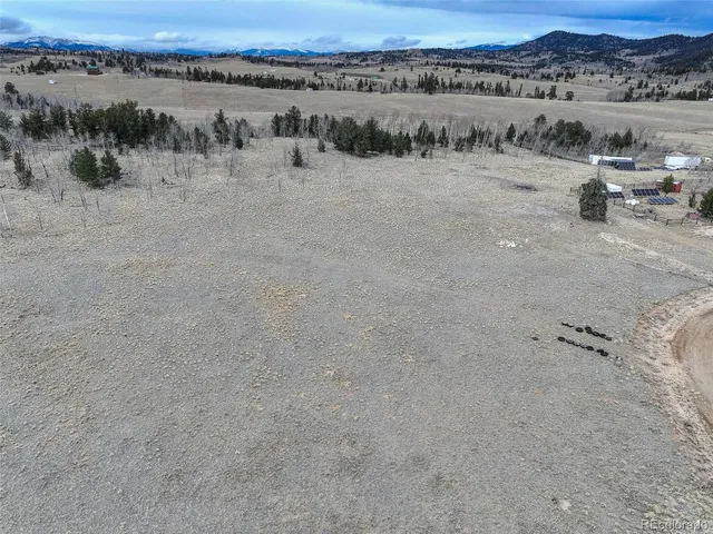 a view of a lake with mountain and trees