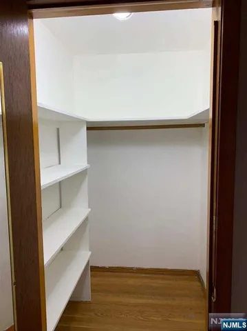 a view of room with furniture and closet