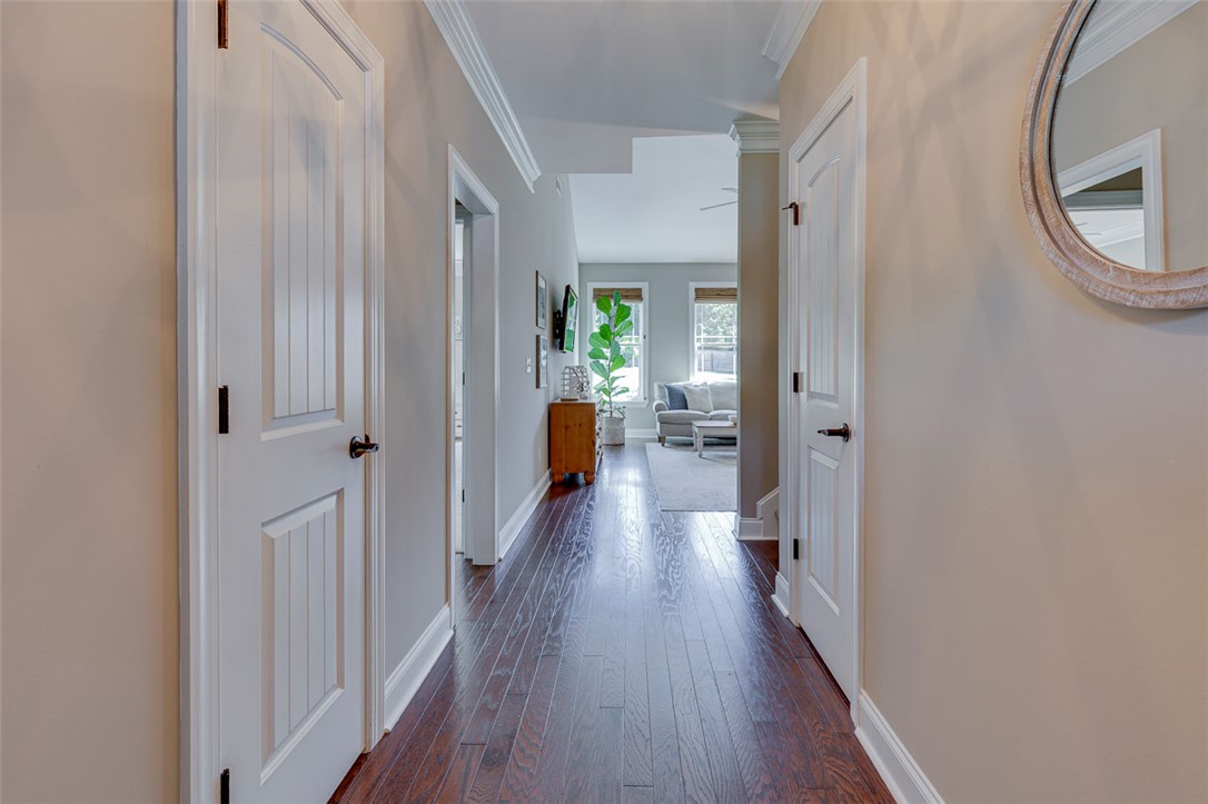203 Streams Way Anderson, SC 29625 - Photo 4 of 47 This spacious hallway features elegant hardwood flooring, leading to a bright and inviting living area.