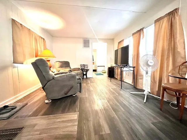 a kitchen with a stove and a refrigerator