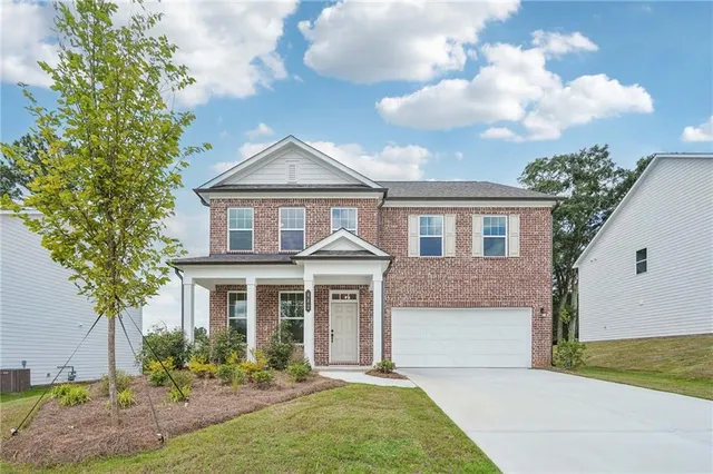 front view of a house with a yard