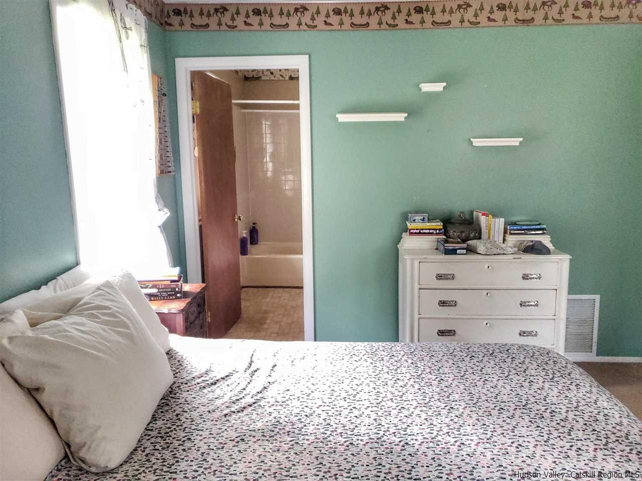 536 Joel M Austin Road Cairo, NY 12413 - Photo 12 of 21 a bedroom with a bed and a dresser