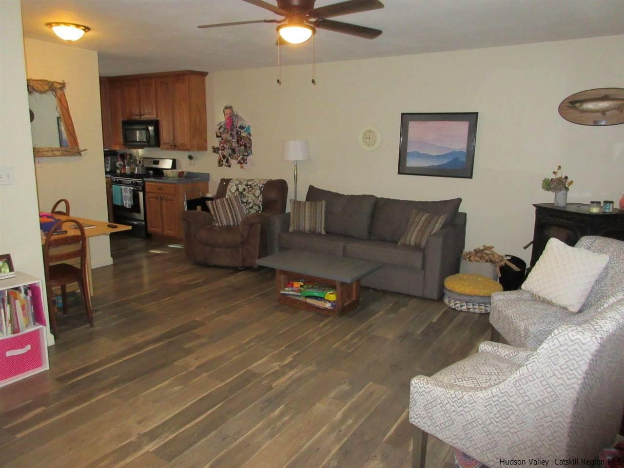 536 Joel M Austin Road Cairo, NY 12413 - Photo 4 of 21 a living room with furniture and a wooden floor