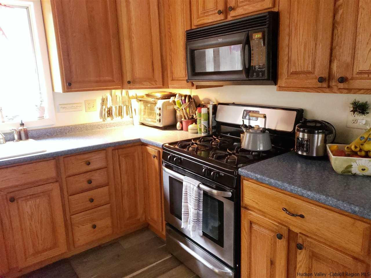 536 Joel M Austin Road Cairo, NY 12413 - Photo 8 of 21 a kitchen with granite countertop a sink cabinets and stainless steel appliances