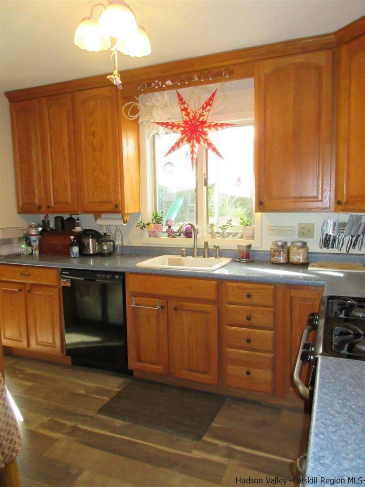 536 Joel M Austin Road Cairo, NY 12413 - Photo 9 of 21 a kitchen with stainless steel appliances granite countertop a stove a sink and a microwave