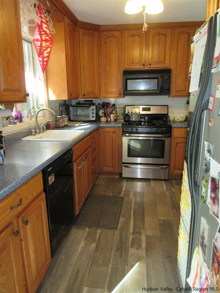 536 Joel M Austin Road Cairo, NY 12413 - Photo 10 of 21 a kitchen with stainless steel appliances a stove a sink and a microwave