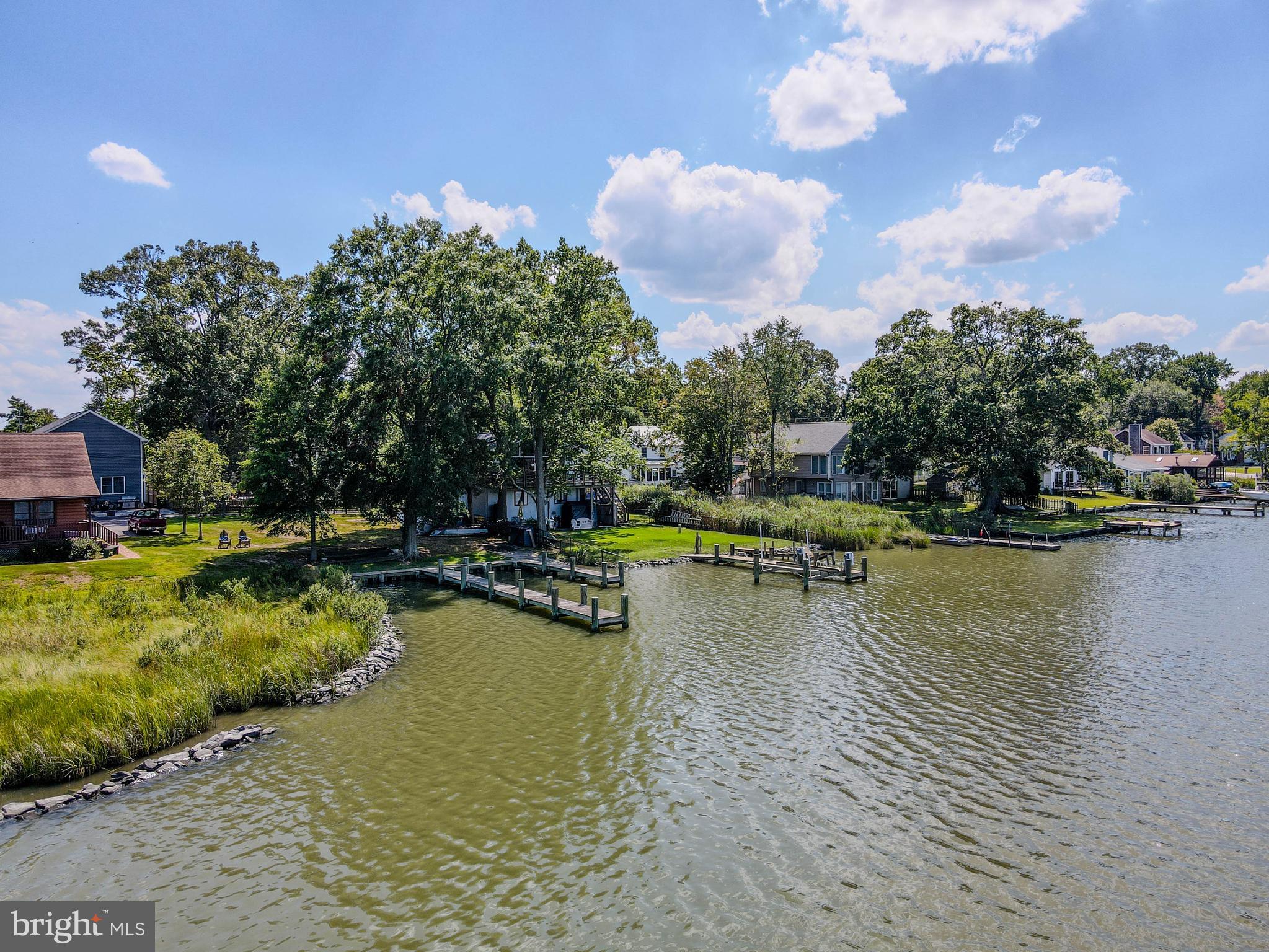 964 Main Street Deale, MD 20751 - Photo 9 of 14 a view of a swimming pool and lounge chair