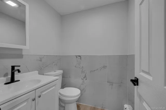 a bathroom with a sink a toilet and a shower