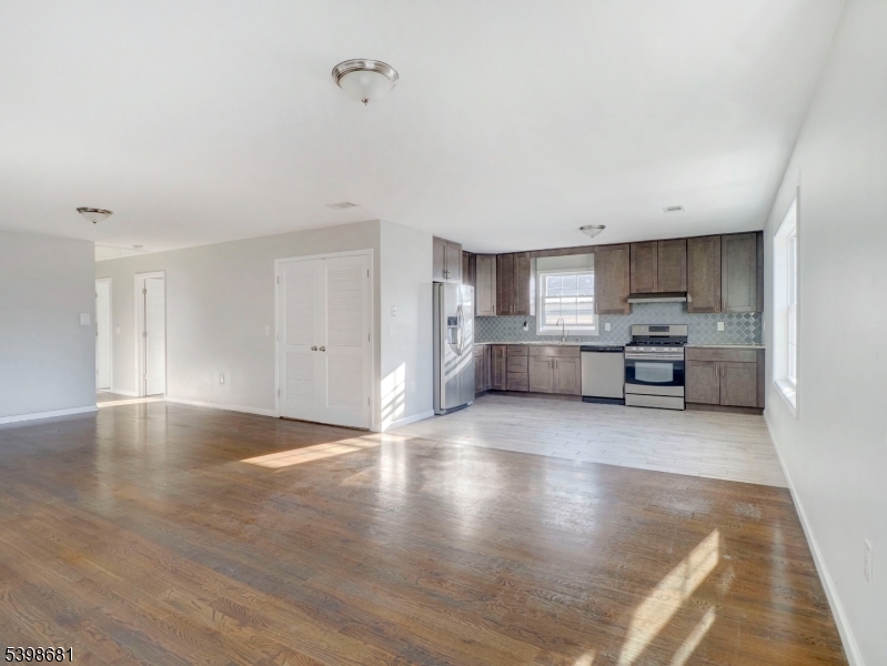 521 Walnut Street, Unit 2 Elizabeth, NJ 07201 - Photo 6 of 13 a view of kitchen with refrigerator and wooden floor