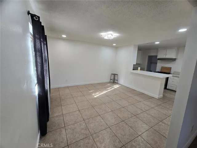 a view of a kitchen with a sink and a window