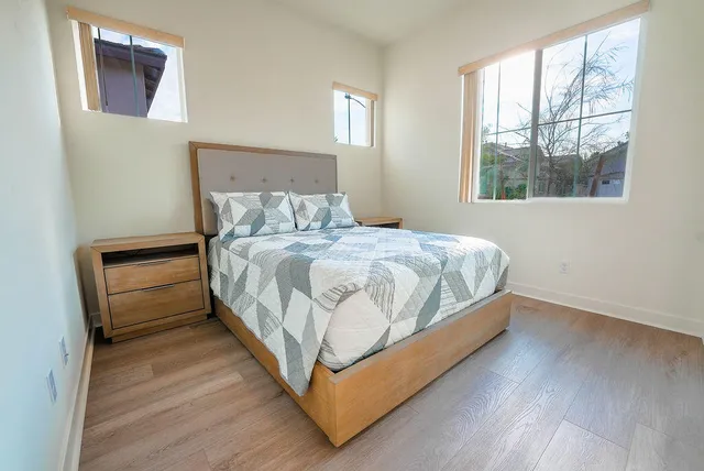 a bedroom with a bed and a window