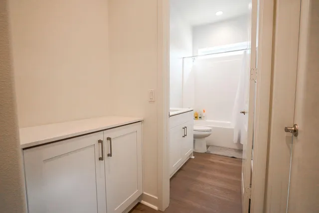 a bathroom with a granite countertop sink