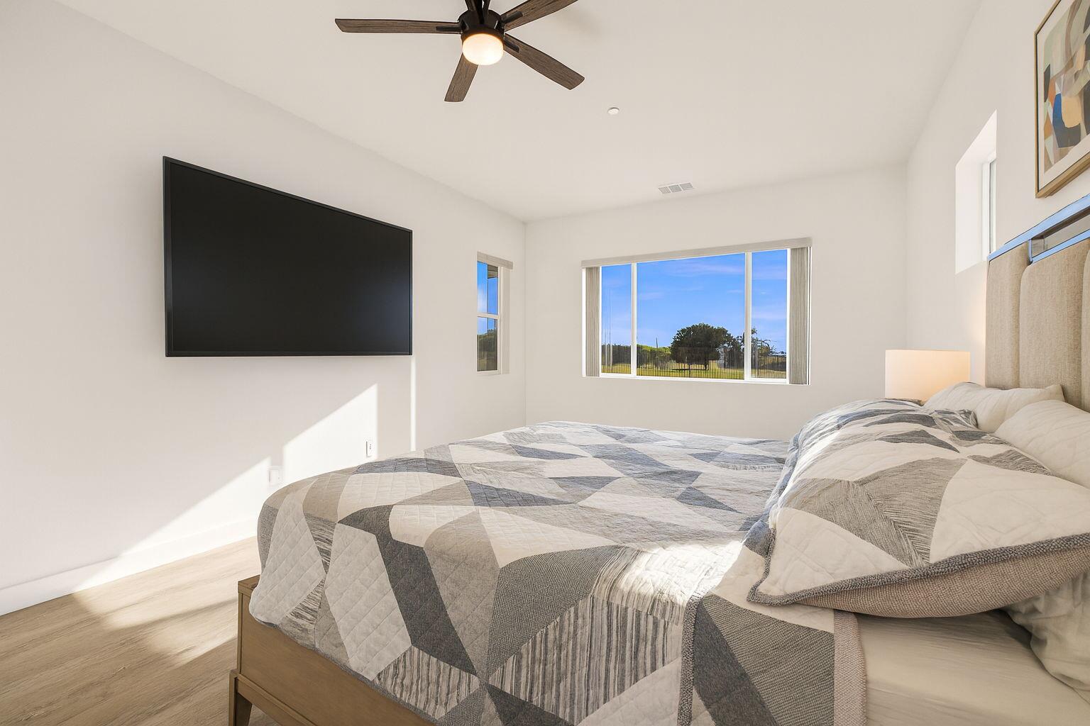 Undisclosed Address Indio, CA 92201 - Photo 27 of 39 55-web-or-mls-Modern Bedroom with TV