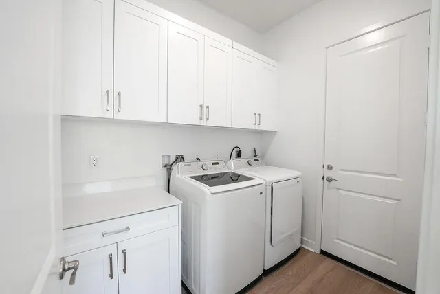 a view of a storage and utility room with a sink