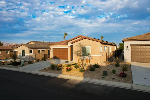 a view of house with yard