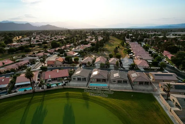 a view of a lake in middle of the town