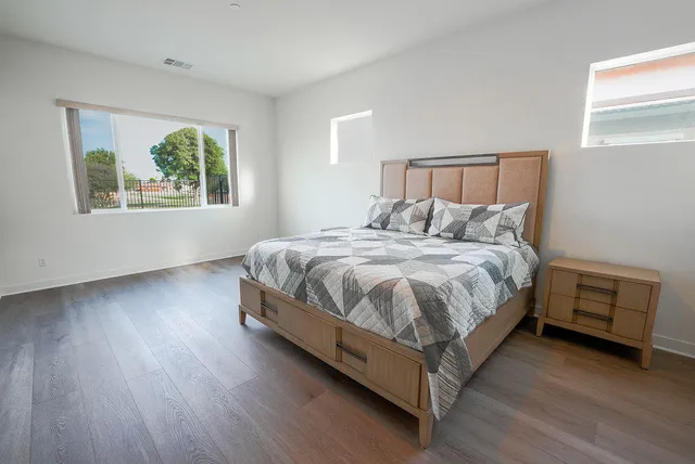 a bedroom with a bed and window