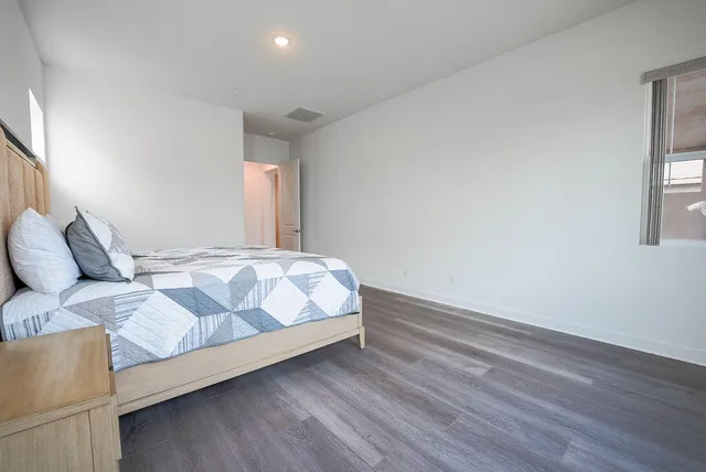 a bedroom with a bed and window