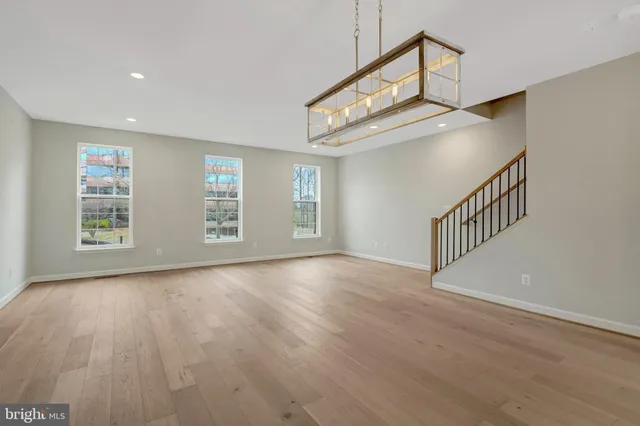 a view of an empty room with windows