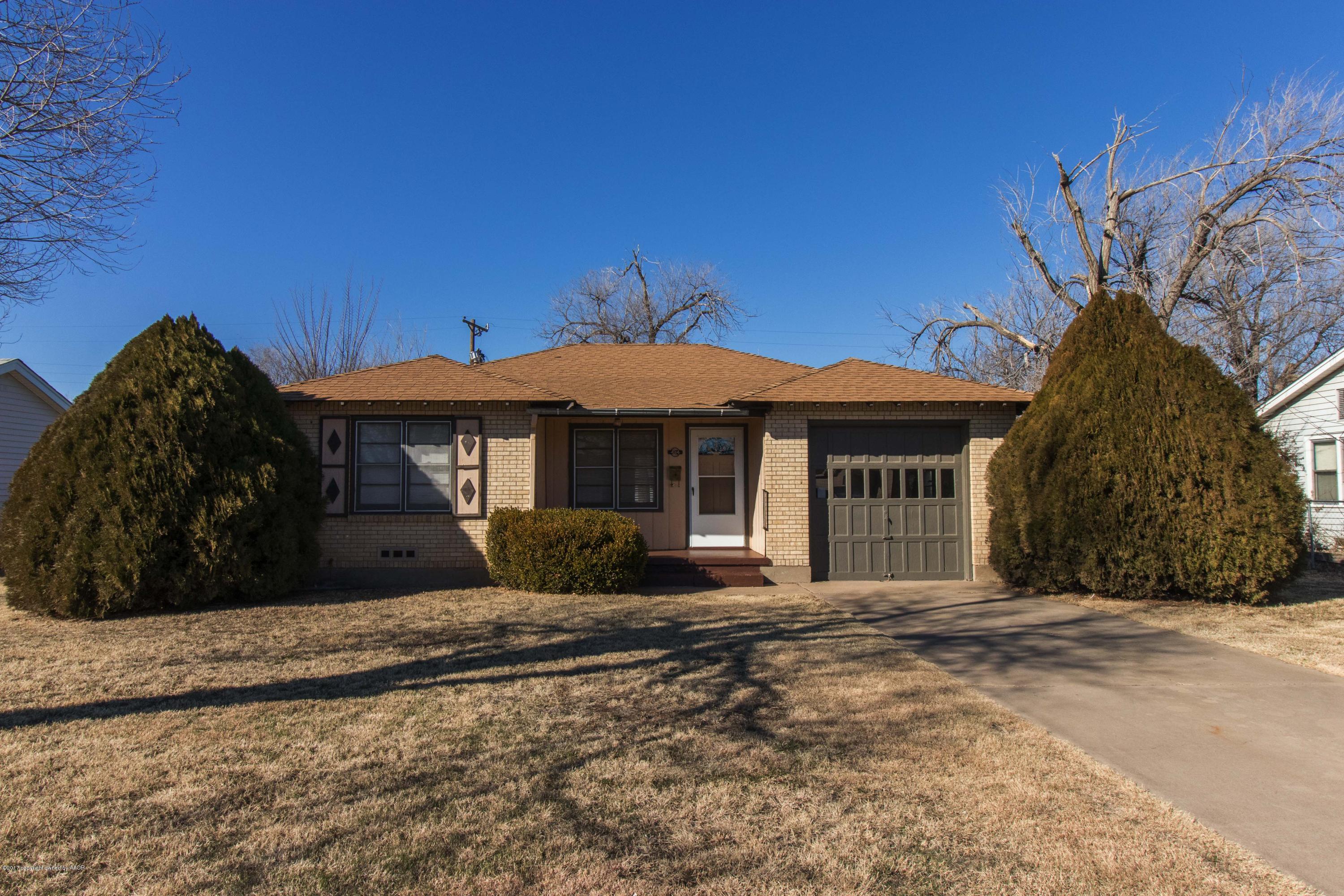 4314 Parker Street Amarillo, TX 79110 - Photo 1 of 20 a front view of a house with a garden