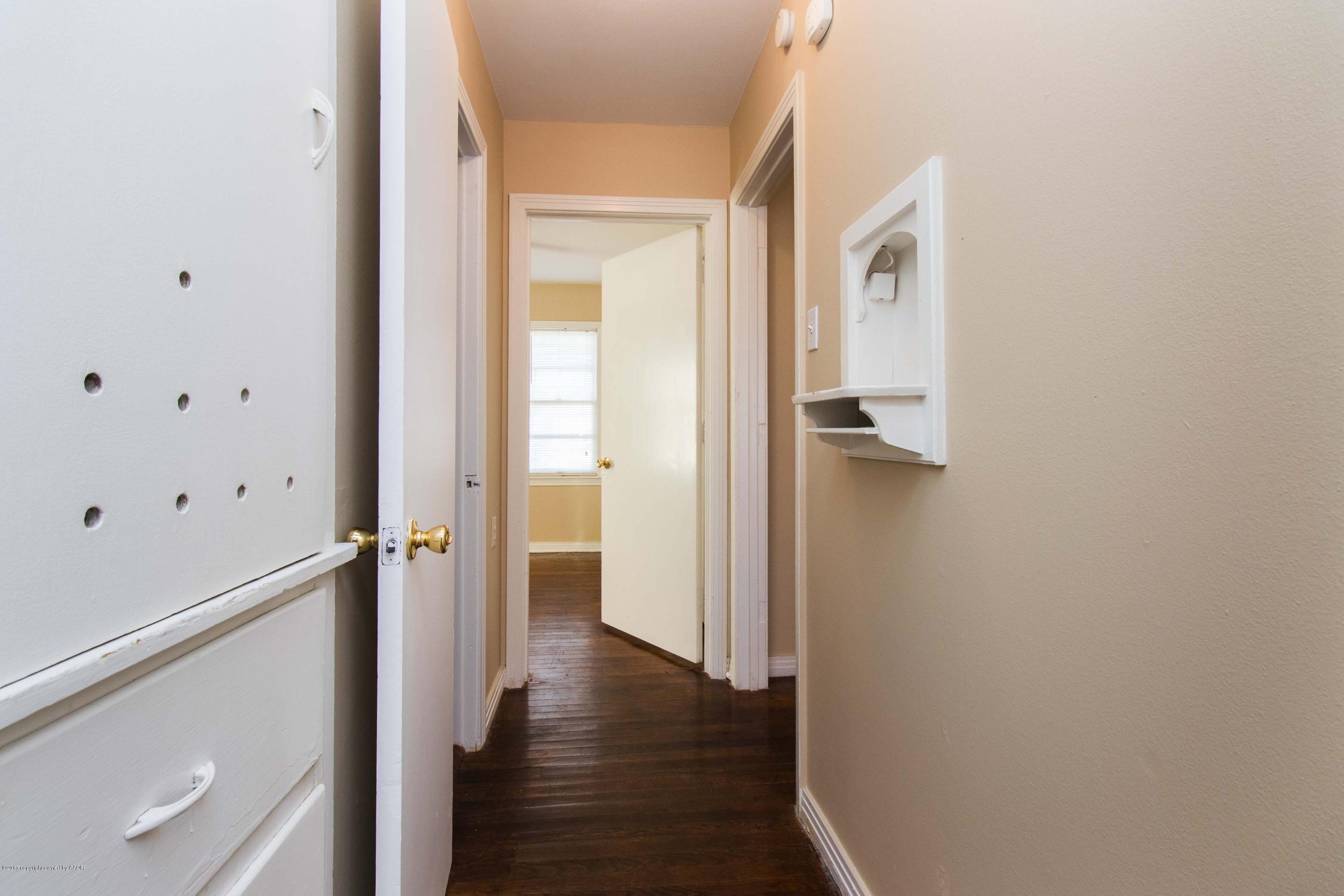 4314 Parker Street Amarillo, TX 79110 - Photo 14 of 20 a view of a hallway with wooden floor