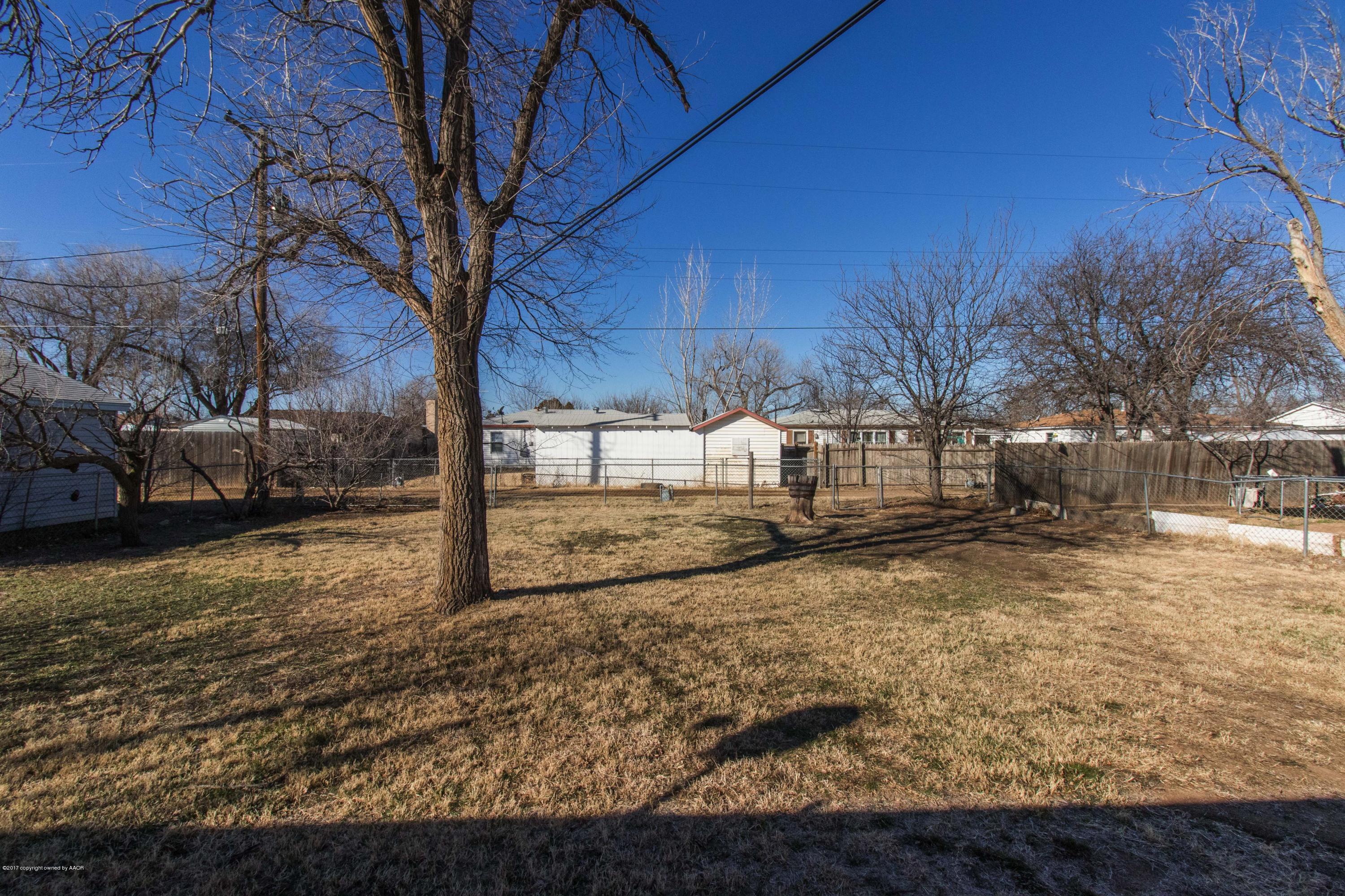 4314 Parker Street Amarillo, TX 79110 - Photo 19 of 20 a view of a yard with a tree