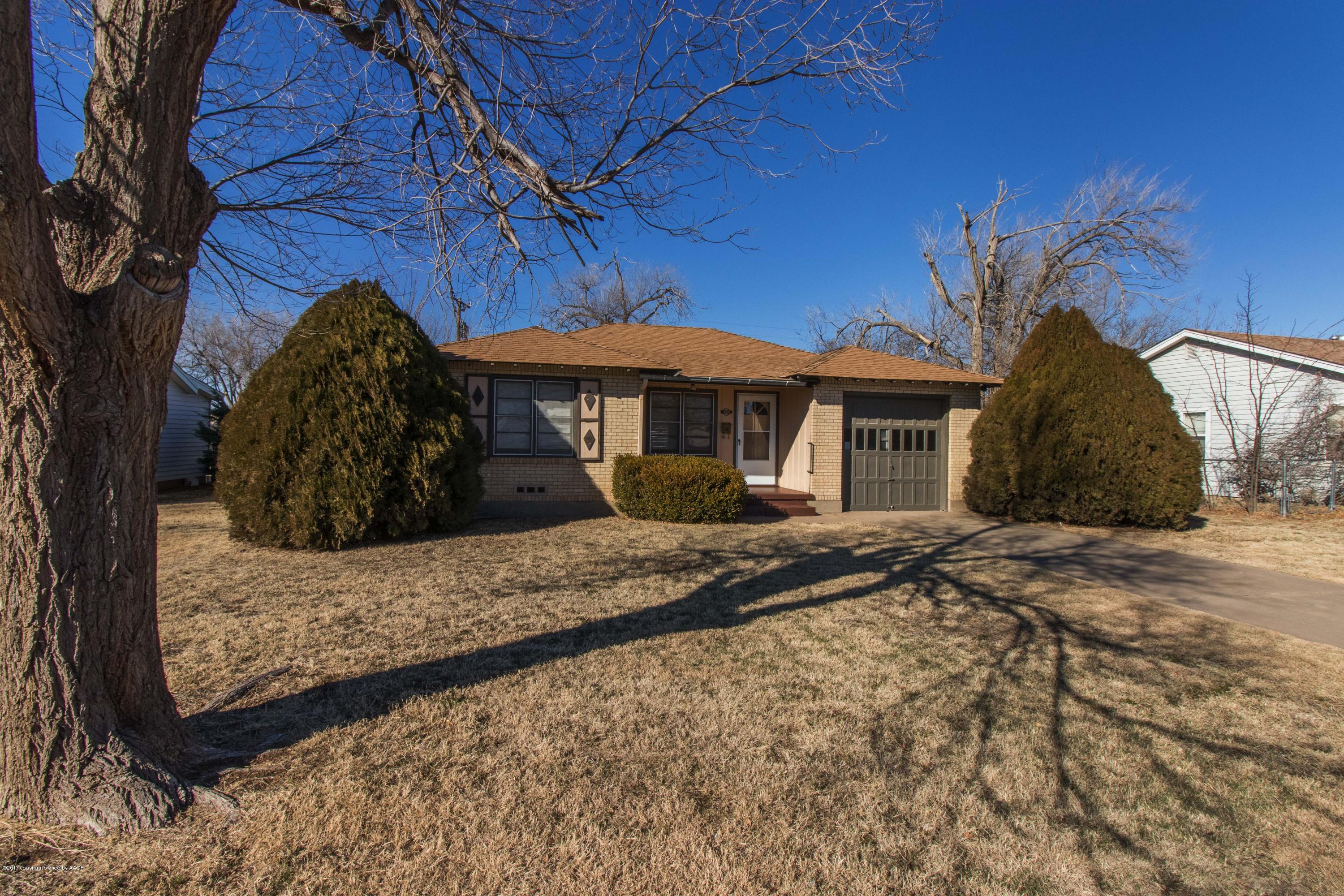 4314 Parker Street Amarillo, TX 79110 - Photo 2 of 20 a front view of a house with a yard