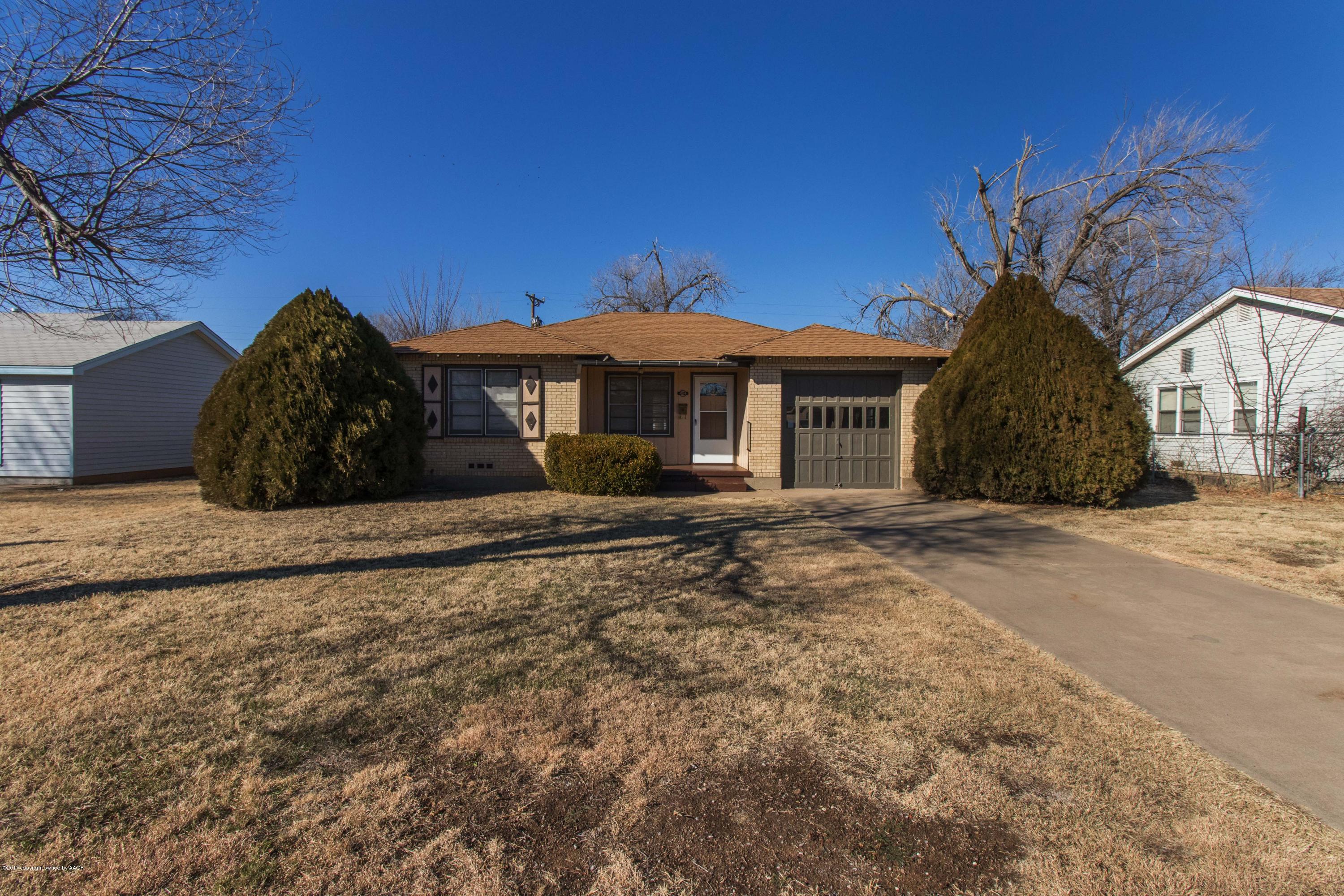 4314 Parker Street Amarillo, TX 79110 - Photo 3 of 20 a front view of a house with a garden