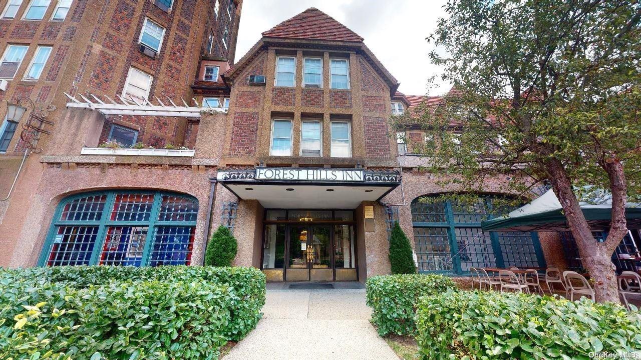 1 Station Square, Unit 403 Queens, NY 11375 - Photo 1 of 1 front view of a brick house with a small yard