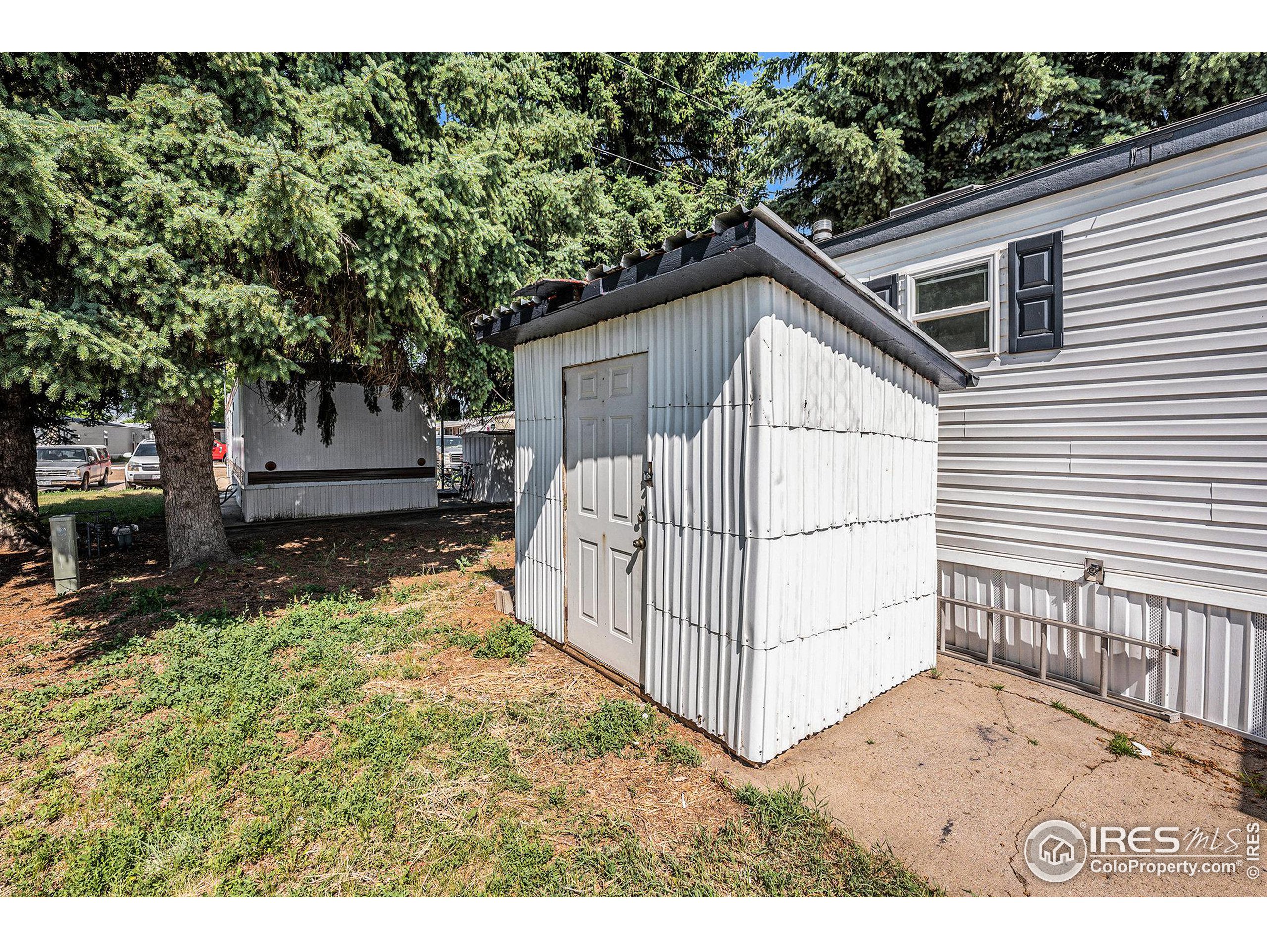 230 North 2nd Street, Unit 26 Berthoud, CO 80513 - Photo 20 of 21 a view of a house with a yard