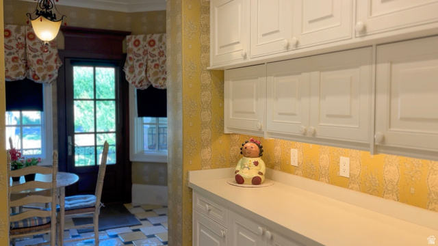 426 West Center Street Parowan, UT 84761 - Photo 41 of 107 White cabinetry with integrated hardware, light-toned countertops, and a patterned backsplash