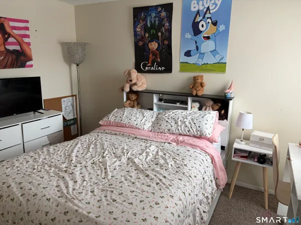 a bedroom with a bed and furniture