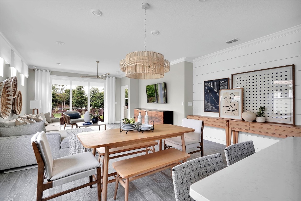 636 Del Webb Parkway Yulee, FL 32097 - Photo 6 of 37 a living room with fireplace furniture and a large window