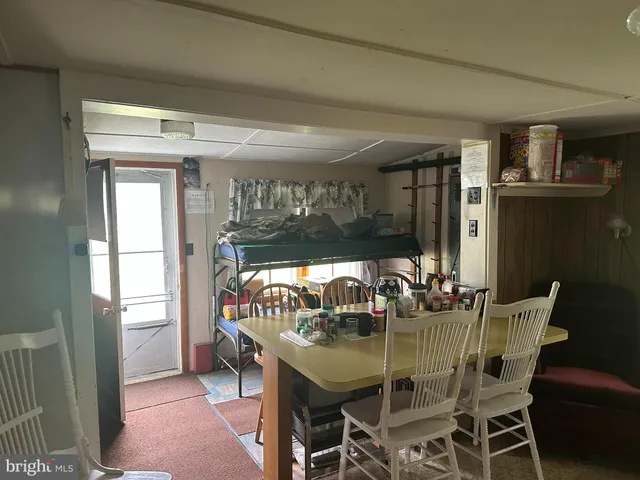 a room with a table and chairs