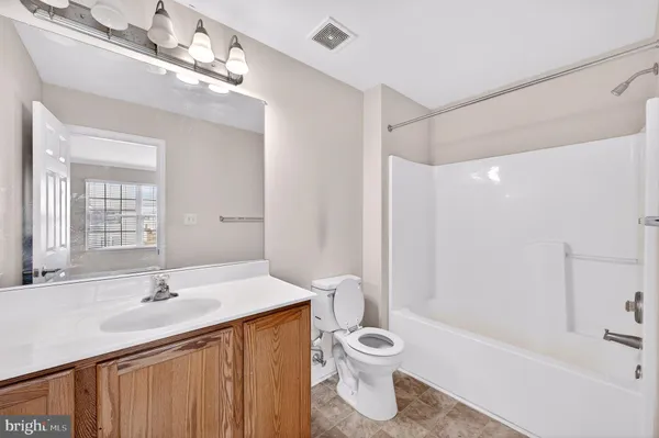 a bathroom with a sink double vanity and a bathtub