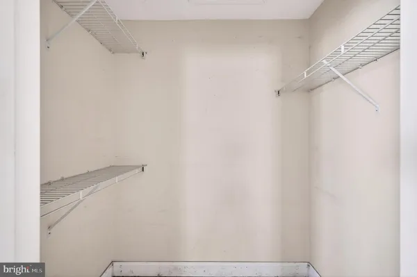 a view of a yard with wooden fence