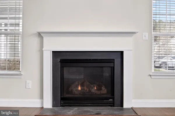 a living room with a fireplace