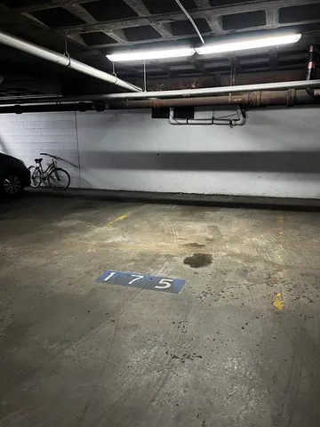 a view of a room with wooden cabinets