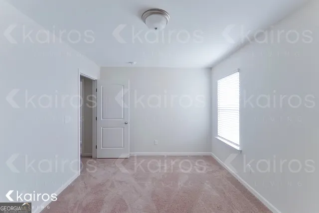 a view of an empty room and window